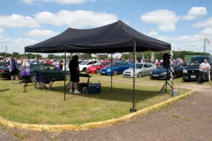 A sun shade used for on of our outside car show events with a DJ playing music.