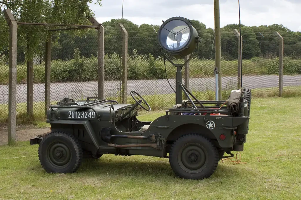 A restored US Army jeep with powerful searchlight fitted to the rear.