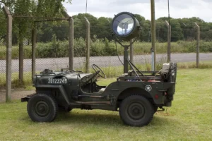 A restored US Army jeep with powerful searchlight fitted to the rear.