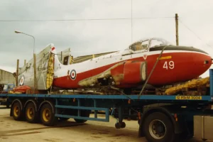 This image shows the Hawker Hunter numbered XG274 being transported from its original position.