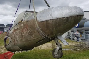 An image showing the original state of the De Havilland Vampire during its lifting removal.