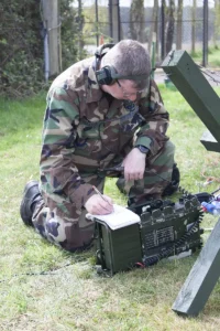 A radio ham operator transmitting on a British military Clansman radio set.
