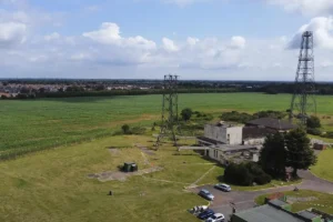 An aerial view of our site showing the old World War 2 building and the more modern Autovon radio communication towers.