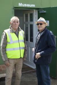Two of our staff member standing outside the main museums entrance.
