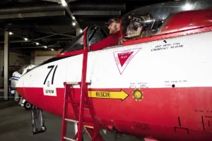 Showing one of the museum's visitors sitting in our restored Hawker Hunter numbered XG274.