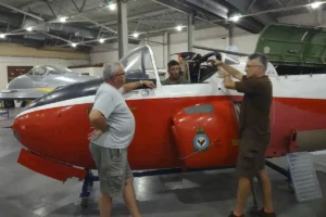 Three of our volunteers rebuilding the canopy on our Jet Provost.