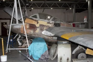 Our De Havilland Vampire in the process of being repaired. This image shows the poor state of repair to the outer skin of the aircraft.